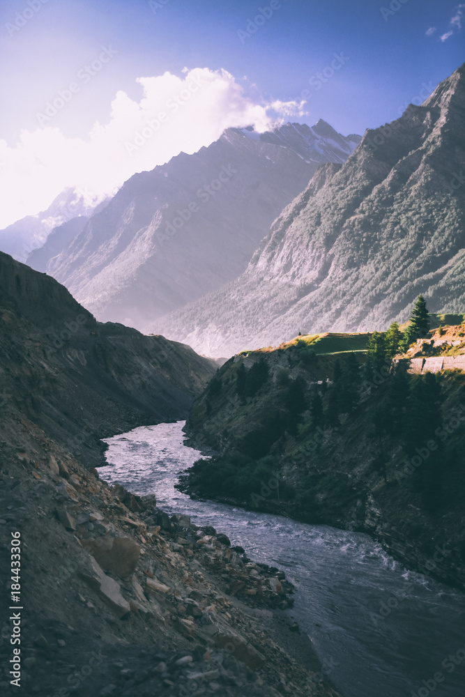 beautiful mountain river in valley and majestic mountains in indian himalayas, keylong region