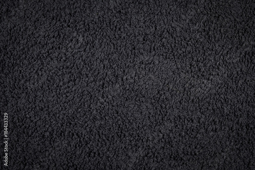 Black towel fabric closeup, texture pattern background