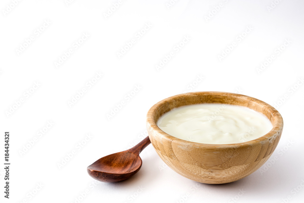 Natural yogurt in wooden bowl isolated on white background. Copyspace
Natural yogurt in wooden bowl isolated on white background. Copyspace