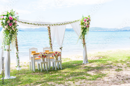 Beach Wedding Arch with copy space in right. Landscape and Wedding ceremony concept. Beach and Seashore theme.