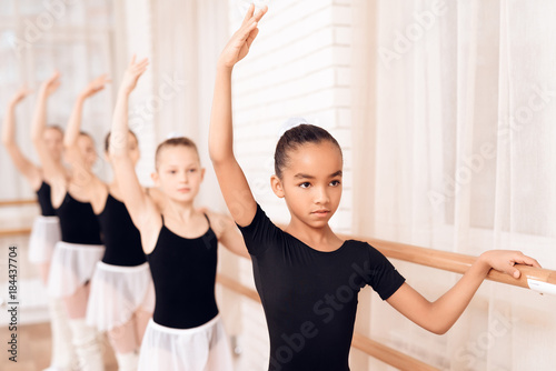 Fototapeta Naklejka Na Ścianę i Meble -  Young ballerinas rehearsing in the ballet class.