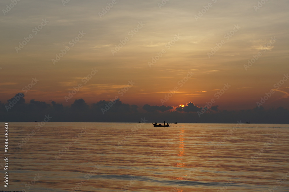 local fishery boat with sun rise scene