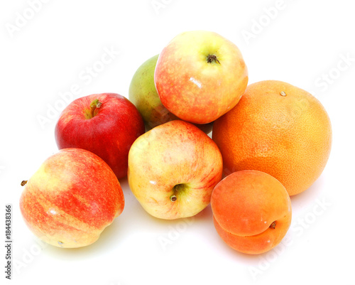 fresh red apples and plum, pomelo isolated on white background