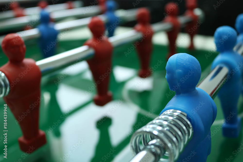Table football game with red and blue players team
