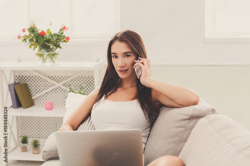 Freelancer working at home with laptop and mobile Freelancer working at home with laptop and mobile