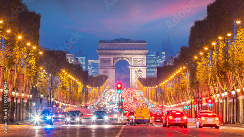 Famous Champs-Elysees and Arc de Triomphe at twilight in Paris © f11photo