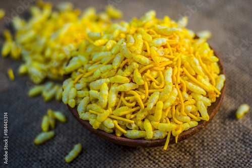 Close up of Indian snack Sev Mumra  in a clay bowl.