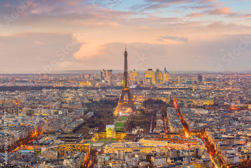 Skyline of Paris with Eiffel Tower at sunset in France © f11photo