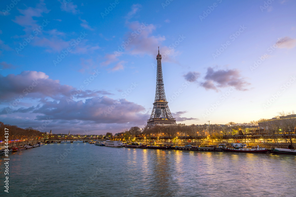Fototapeta premium The Eiffel Tower and river Seine at twilight in Paris