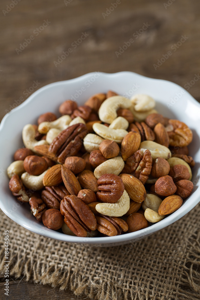 mixed nuts on wooden surface mixed nuts on wooden surface