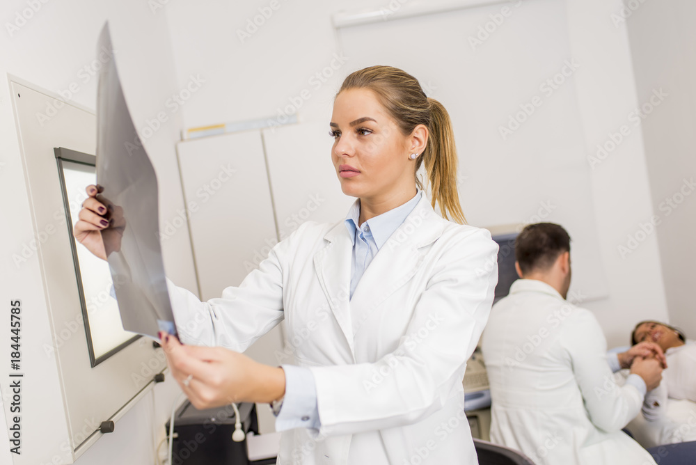 Fototapeta premium Radiologist lokking at x-ray in a clinic medical lab