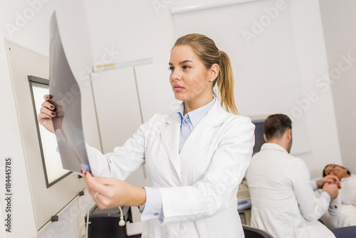 Radiologist lokking at x-ray in a clinic medical lab