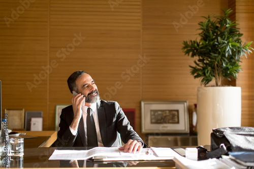 Senior businessman using mo...