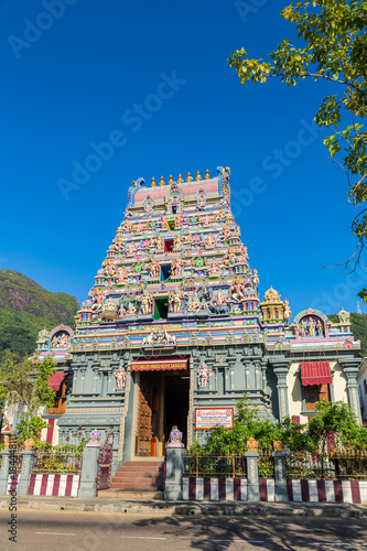 Colorful facade of a Hindu temple in Victoria, Mahe, Seychelles, also known as ARUL MIHU NAVASAKTHI VINAYAGAR. Vertical composition photo