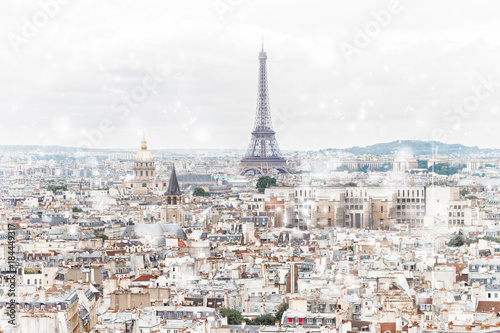 Paris city roofs skyline with Eiffel Tower from above at winter, France