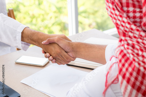 business success concept : arab business people meeting team partner ,happy hand shake communication
