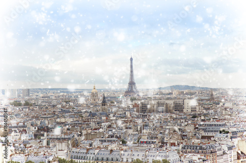 skyline of Paris city with eiffel tower from above under snow, France