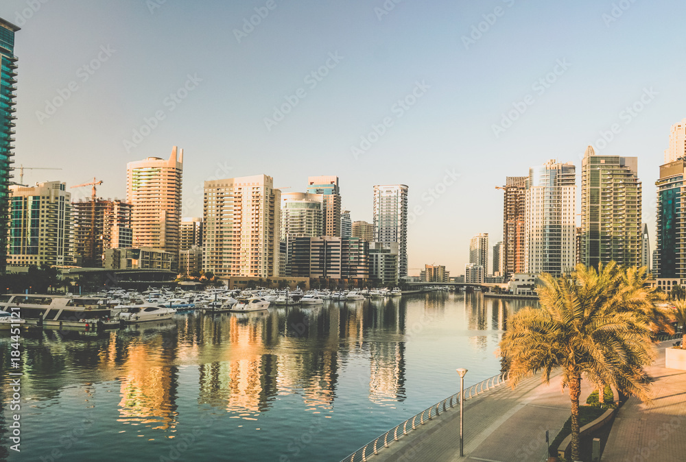 Naklejka premium Dubai. The waterfront of Dubai Marina in the early morning. Toning instagram.