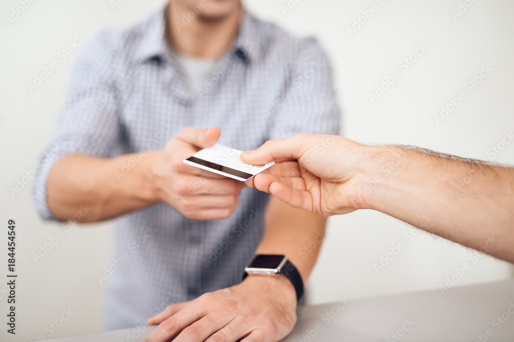 The guy and the girl pay for the purchase of a chainsaw. The guy and the girl pay for the purchase of a chainsaw.