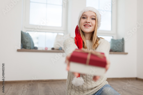 Teenage girl with Christmas presents