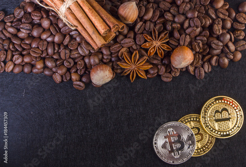 Gold Bitcoin surround by coffee bean photo
