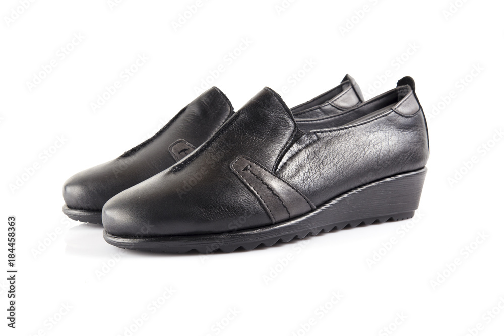 Female black leather shoe on white background, isolated product, comfortable footwear. Female black leather shoe on white background, isolated product, comfortable footwear.