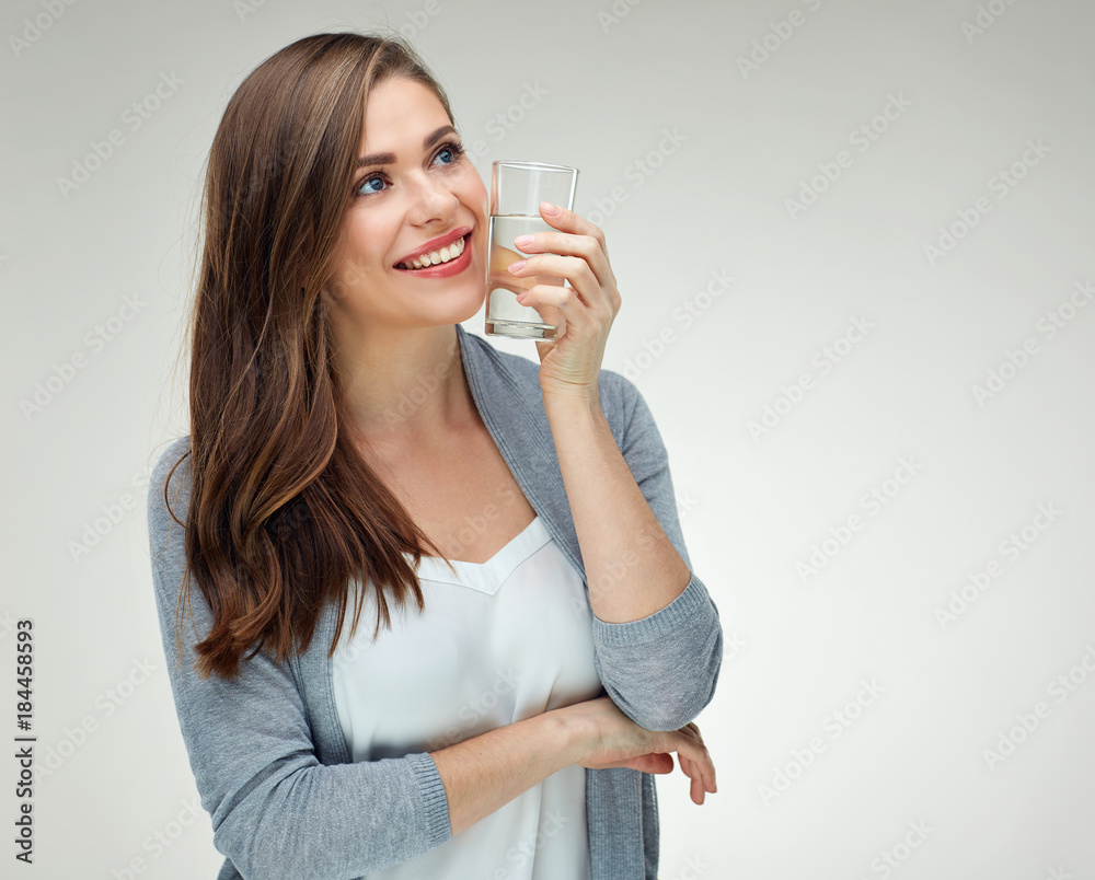Smiling woman holding water glass. Isolated portrait on white Smiling woman holding water glass. Isolated portrait on white