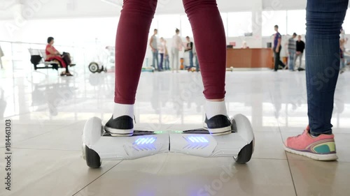 riding on hyroscooter in mall, modern technologies photo