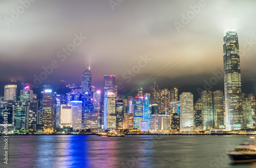 Downtown skyscrapers with city lights at night from Kowloon. Hong Kong, China © jovannig