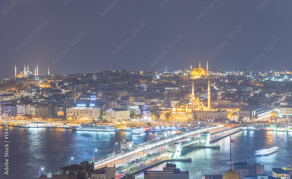 ISTANBUL - SEPTEMBER 2014: Aerial view of city skyline at night. The city attracts 20 million people annually