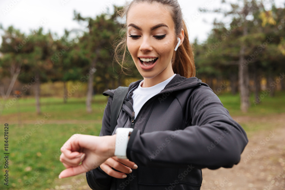 Portrait of a happy fitness girl in earphones Portrait of a happy fitness girl in earphones