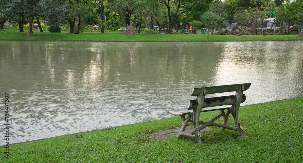 An other view of A wooden chair that placing alongside the lake created a distraught scenic under the light of the evening, giving mood and feel of reminiscent. An other view of A wooden chair that placing alongside the lake created a distraught scenic under the light of the evening, giving mood and feel of reminiscent.