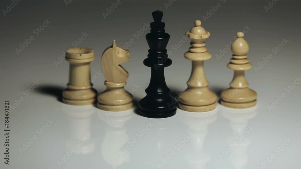 Chess Pieces: Black King Falling, White Rook, Officer, Queen, and Knight Standing Chess Pieces: Black King Falling, White Rook, Officer, Queen, and Knight Standing
