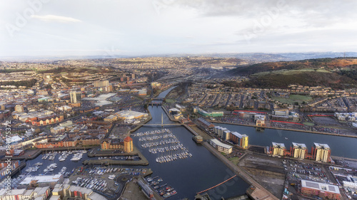 Editorial SWANSEA, UK - DECEMBER 12, 2017: An aerial view of the River Tawe in Swansea City, showing the new development around the Prince of Wales Dock, St Thomas, Port Tennant and Kilvey Hill photo