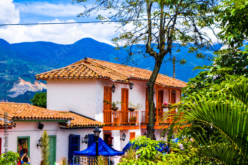 Facade view of clay rooftops with some colorful buildings in Pueblito Paisa in Nutibara Hill, reproduction of the traditional Colombian township in Medellin city photo