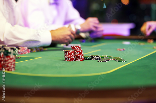 Casino card game with chips on a green background photo