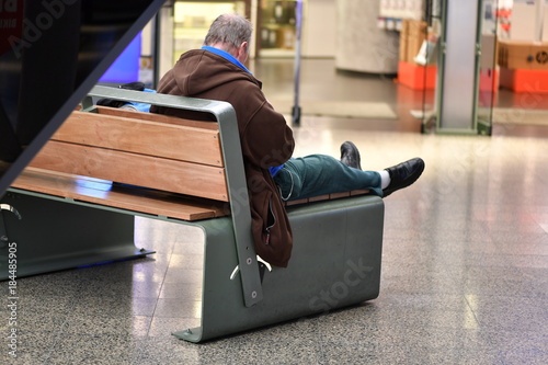 A Man is rasting on a bench in Berlin  photo