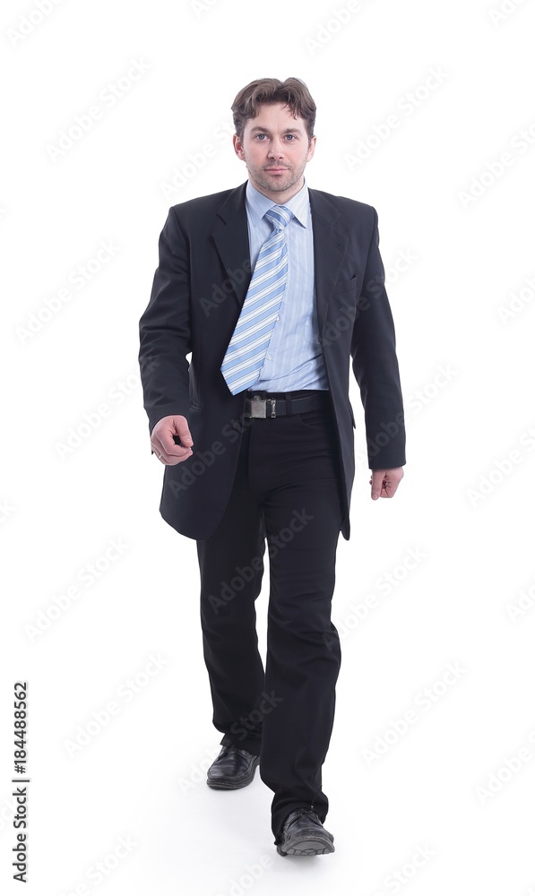 in full growth. businessman goes forward.isolated on a white in full growth. businessman goes forward.isolated on a white