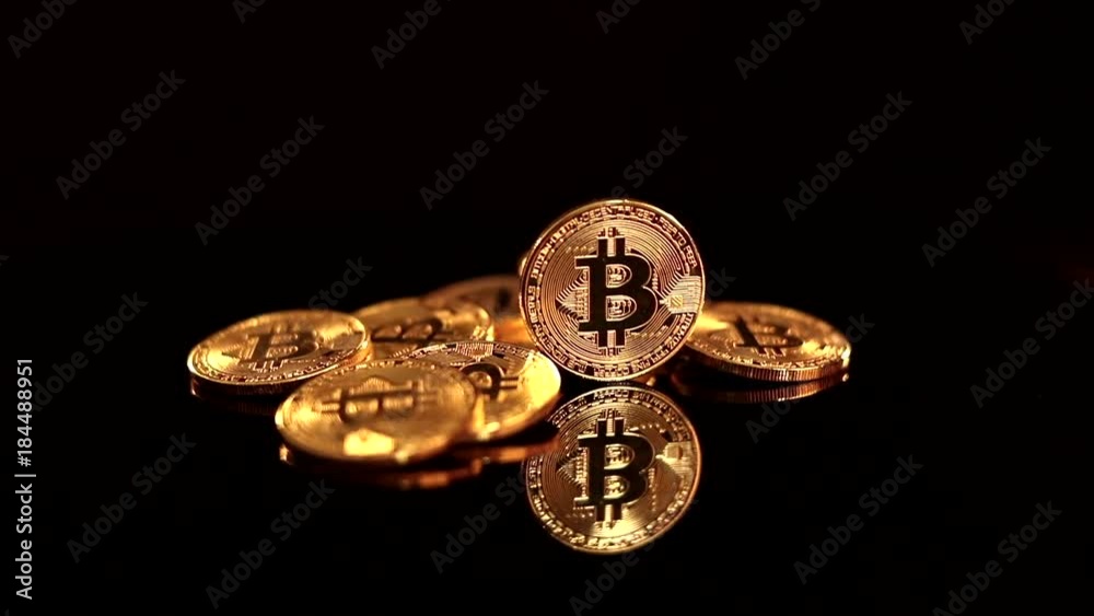 Bitcoin BTC the new virtual internet Cryptocurrency in rotation movement. Isolated on black background Bitcoin BTC the new virtual internet Cryptocurrency in rotation movement. Isolated on black background