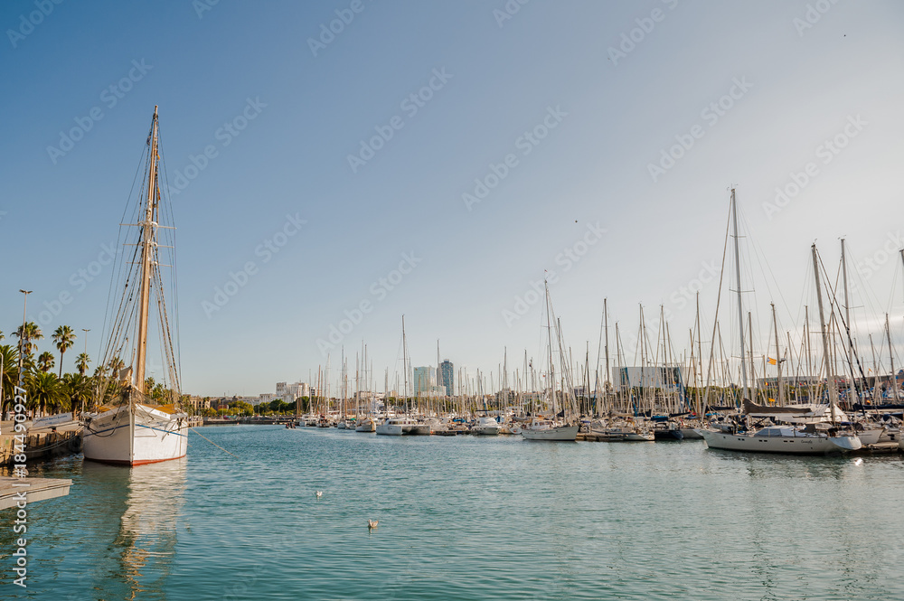 Harbor in Barcelona, boats and yachts on turquoise water