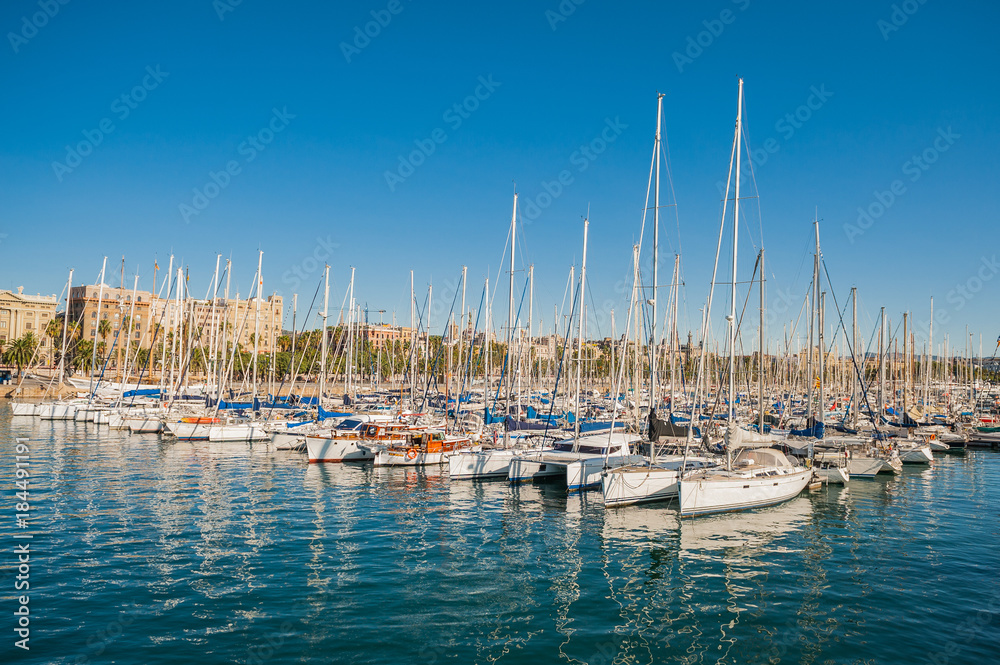 Harbor in Barcelona, boats and yachts on turquoise water