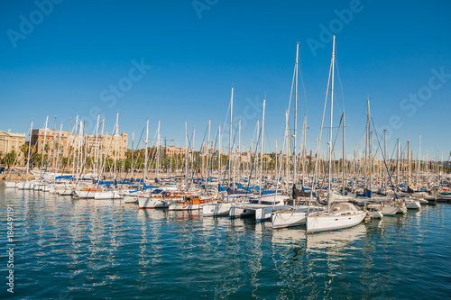 Obraz na płótnie Harbor in Barcelona, boats and yachts on turquoise water w salonie