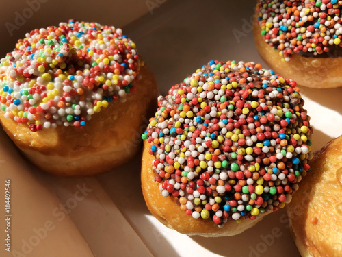 Fresh donuts on bakery display for Hanukkah celebration. photo