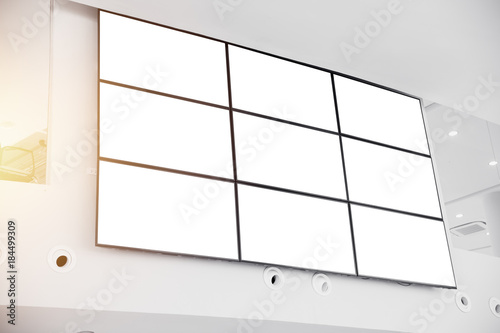 wall LCD display screen panel in modern office building with clipping path at blank screen