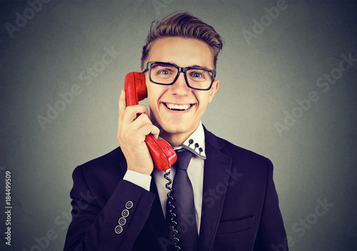 Content smart man talking on phone