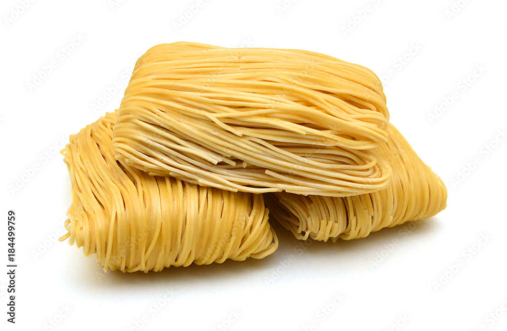 Egg noodles on a white background