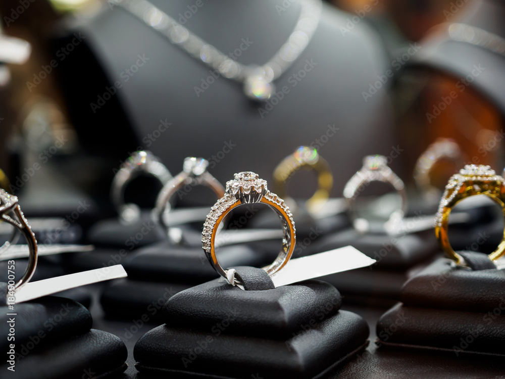 Jewelry diamond rings and necklaces show in luxury retail store window  display Stock Photo | Adobe Stock