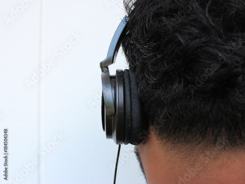 Headphones with men's music. White background.
