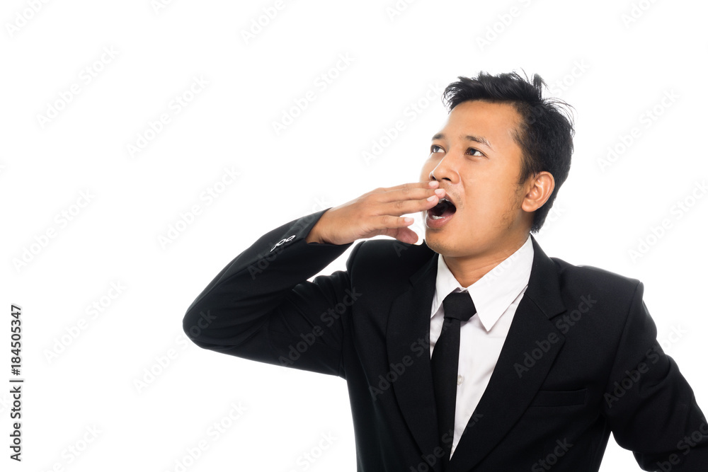 Portrait of a business man is yawning. Isolated on white background Portrait of a business man is yawning. Isolated on white background