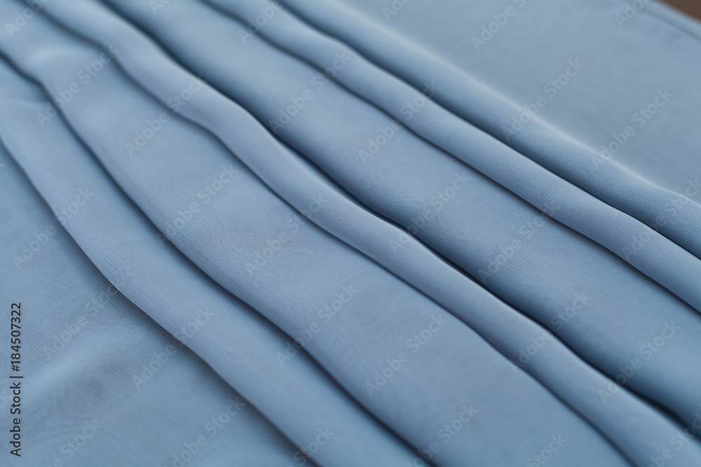Obraz premium Color blue textil, silk fabric with pleats
